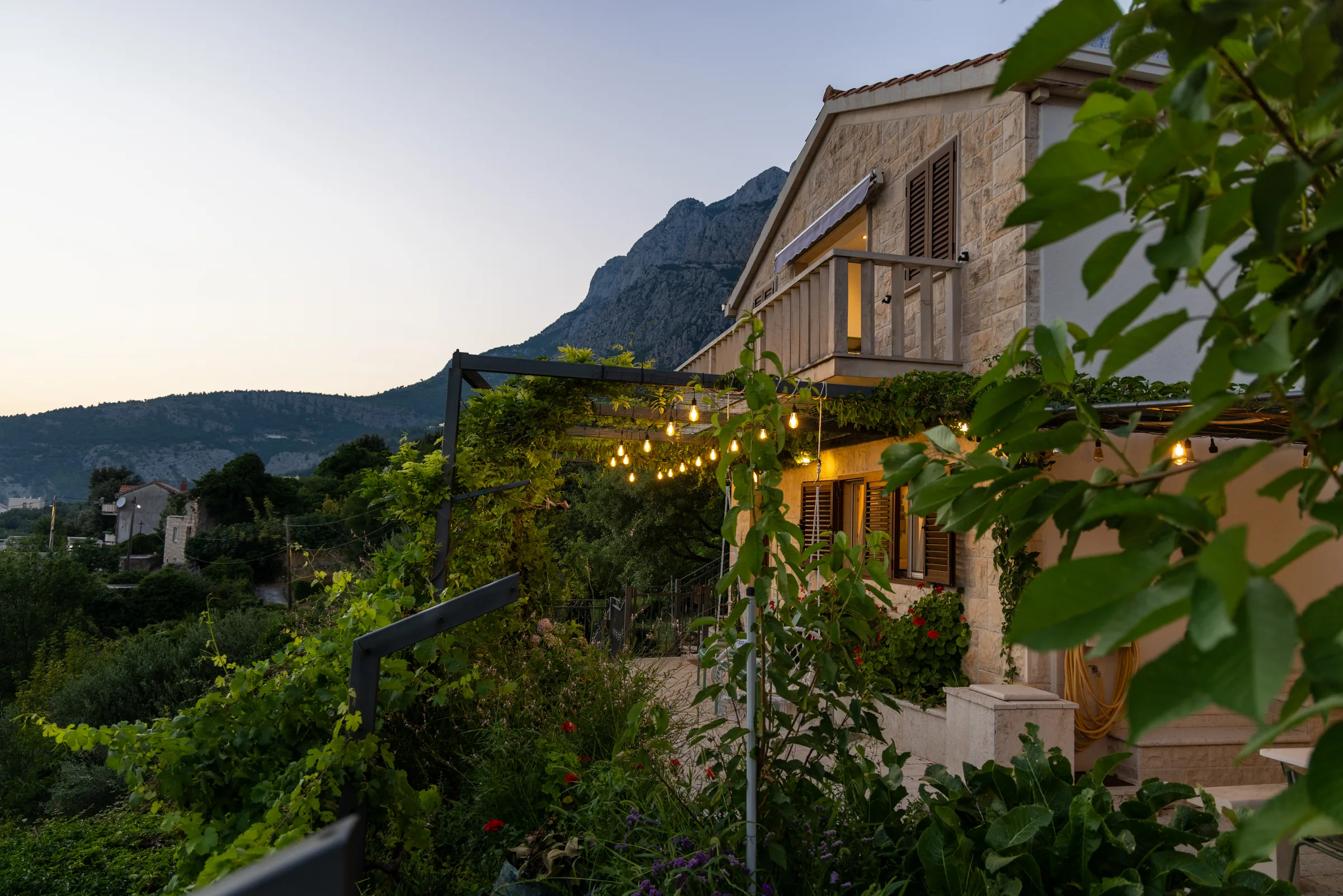Stone villa beneath Biokovo at dusk